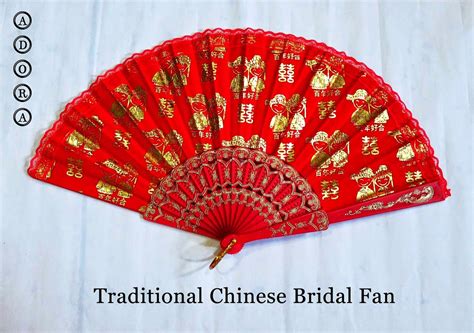 A Red Fan With Gold Writing On It And The Words Traditional Chinese
