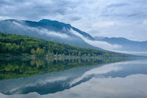 Shades Of Blue And Green Of Misty Bohinj Lake Slovenia Tranquility
