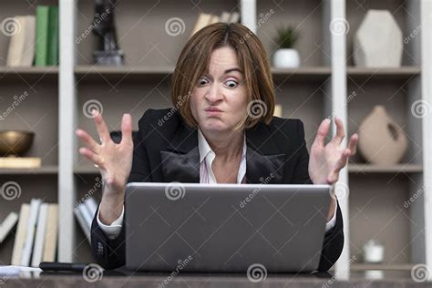 Angry Female Office Worker Demonstrating Her Irritation And