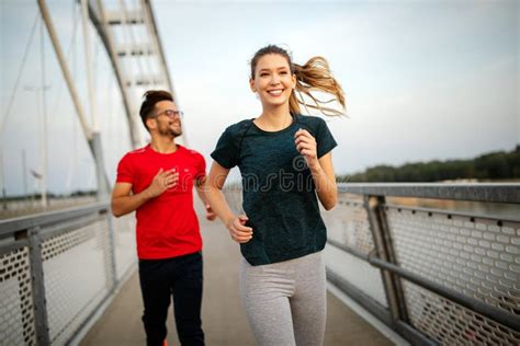Young People Running And Exercising Living Healthy Sporty Lifestyle