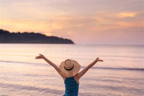Woman Relaxing On The Beach With Sunset In Koh Kood Island Stock Photo