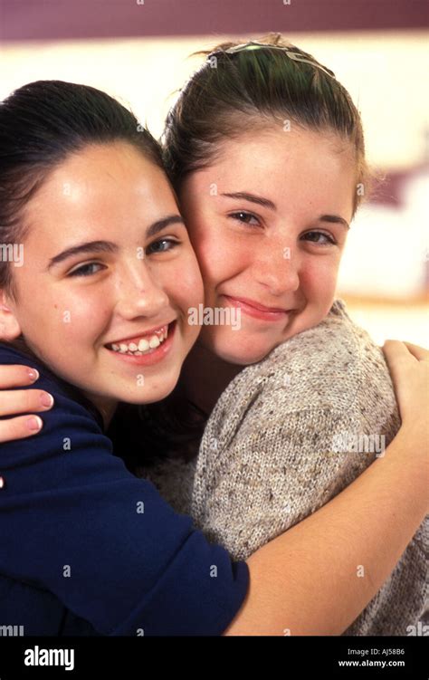 Female Teenage Best Friends Hugging Stock Photo Alamy
