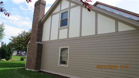 Sail Cloth Hardie Stucco Paired With Khaki Brown Trim And Lap Siding In
