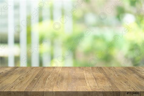 Empty Wood Table Top On Blurred Background At Garden In Stock Photo
