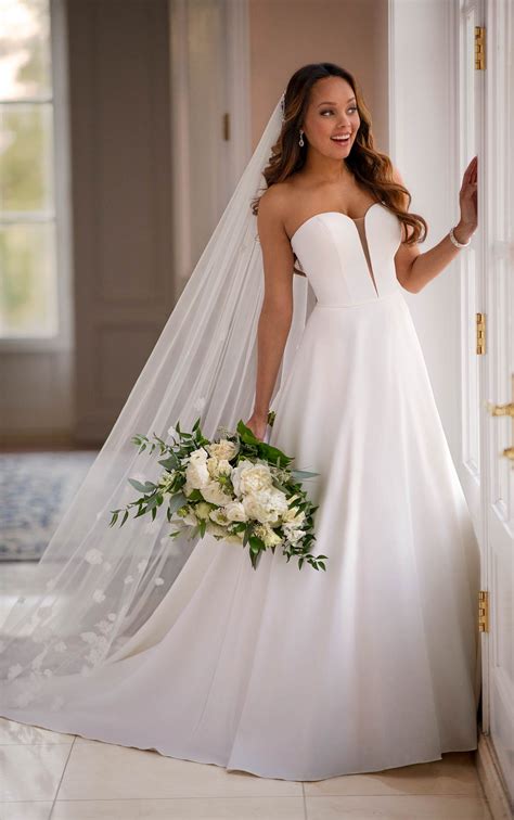 This simple yet stunning wedding dress is perfect for a city wedding or outdoor affair. Strapless Simple Satin Ballgown - Stella York Wedding Dresses