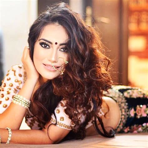 He is depicted as a pale blue figure, holding lotus bud in one hand and mace in the other, a sudarshan chakra, the most powerful weapon in the upper right hand and a conch in the upper left. Surbhi Jyoti Hot Navel New HQ Pics Images In Short Clothes