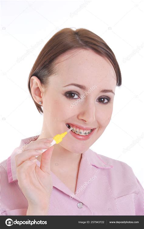 Pretty Girl Brace Cleaning Teeth Stock Photo By ©yayimages 257943722