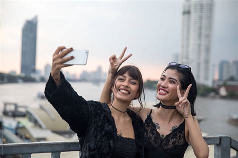 Girlfriend Taking A Selfie Together By Stocksy Contributor Jovo Jovanovic Stocksy