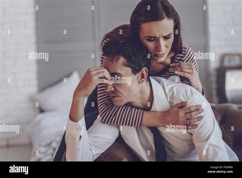 Pleasant Beautiful Woman Hugging Her Husband Stock Photo Alamy