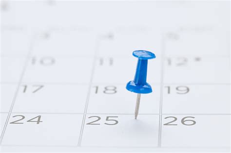 Blue Pin On White Calendar Closeup Shot Stock Photo Download Image