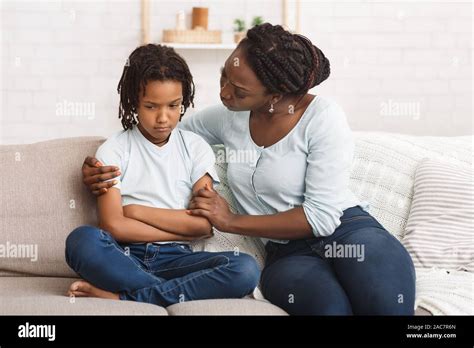 Black Woman Apologizing To Her Grumpy Child Stock Photo Alamy
