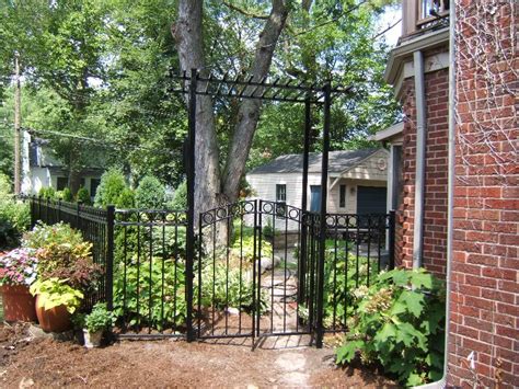 Aluminum fences can go years or decades with just a aluminum fences aren't just for yards and gardens. aluminum fence with double garden gate and arbor (With ...