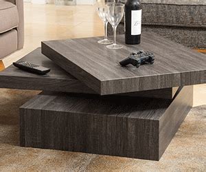 This rotatable black coffee table with its sleek design makes an instant upgrade to your living room. TaarKata | Rotating Coffee Table - TaarKata