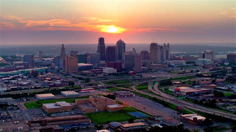A city is a large human settlement. Kansas City Skyline at Sunset, Aerial Drone Flying Shot 4K ...