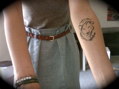 Simple Lion Tattoo On Arm Lion Simple Tattoos Simple Tattoos