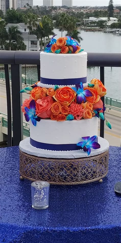 Orange And Blue Wedding Cake Flowers Beach Wedding Planner Wedding
