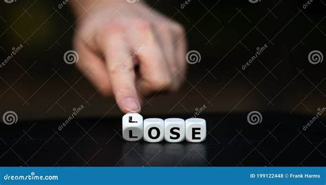 Hand Turns Dice And Changes The Word Lose To Lose Stock Photo