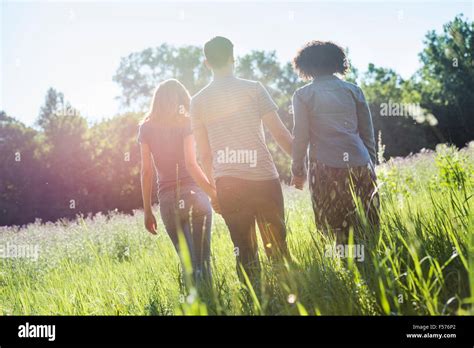 Three People Walking Hi Res Stock Photography And Images Alamy