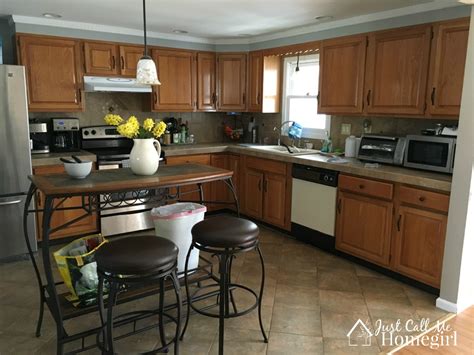 After painting it blue a black glaze was used to give it a nice patina. The Easier Way to Paint Kitchen Cabinets - Just Call Me ...