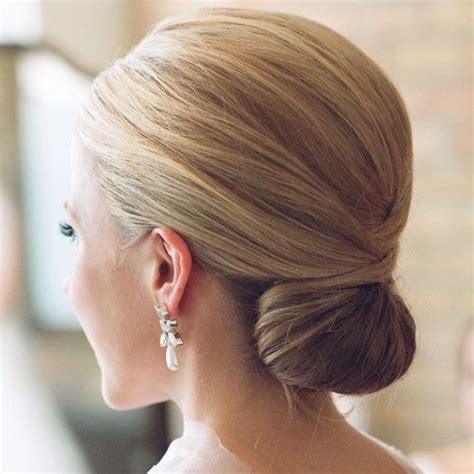 Chignons are generally achieved by pinning the hair into a knot at the nape of the neck or at the back of the head, but there are many variations of the style. Classic Chignon Hairstyle | Bridesmaid hair, Chignon hair ...