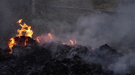 View Of Burning Plastic Waste Causing Air Pollution Stock Video Footage