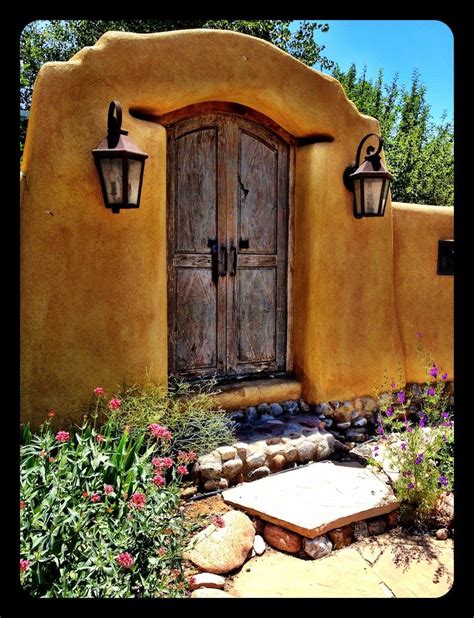 Entry With Rendered Wall And Timber Door Charming Spanish Style