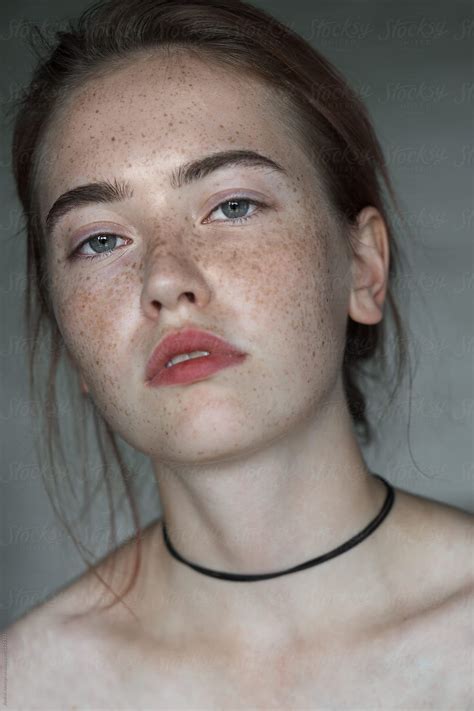 Face Of A Beautiful Girl With Freckles Close Up By Stocksy