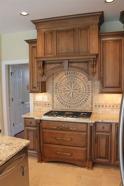 High gloss lacquered vanity cabinet size: Shiloh Cabinetry Maple Acorn With Vandyke Glaze On Perimeter Maple Sable With Black Semi Custom ...
