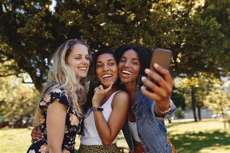 Close Up Portrait Of Happy Multiracial Smiling Group Of Young Woman Taking Selfie On Mobile