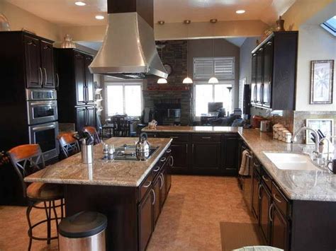 The backer board installs directly onto your cabinets, allowing you to install your stainless steel countertop using familiar countertop installation methods. Bold kitchen remodel with espresso cabinets and stainless ...