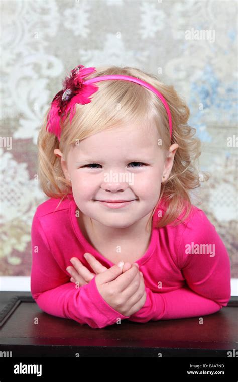 Beautiful Little Girl Posing For Camera In Studio Stock Photo Alamy