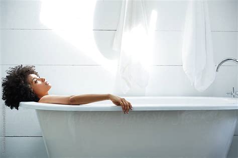 African American Woman Relaxing In Bathtub By Trinette Reed Stocksy United