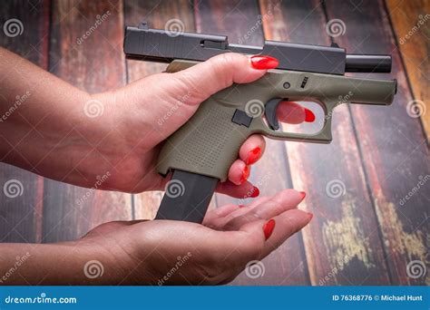 Loading Handgun Magazine Bullets And Pistol Background Charging Gun Stock Image