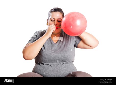 Indian Obese Lady Blowing Balloon Stock Photo Alamy