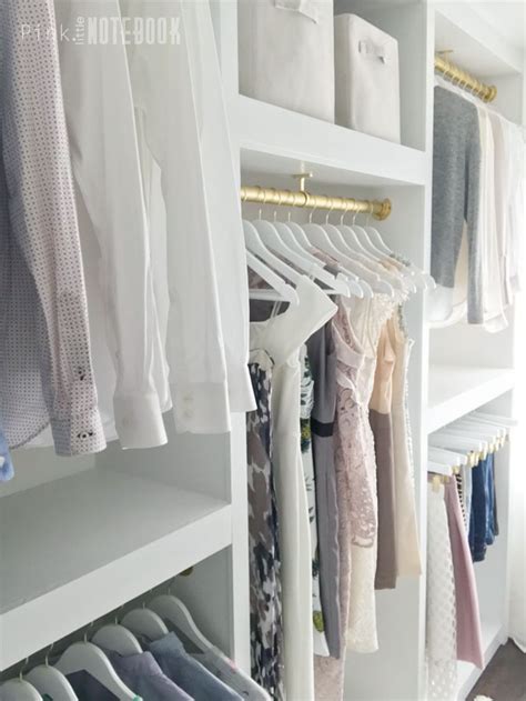 White custom closet organizer is a perfect start to redefining closet storage. Remodelaholic | DIY Custom Walk-in Closet Organizer for a Builder Basic Closet