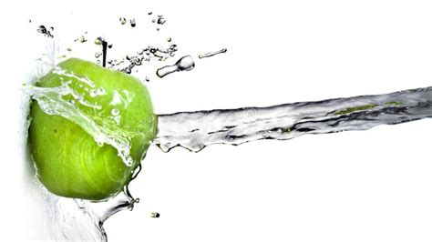 Fresh Water Splash On Green Apple Isolated On White Stock Photo Image