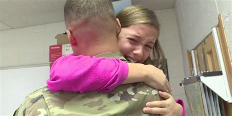 local soldier surprises daughters after returning from deployment