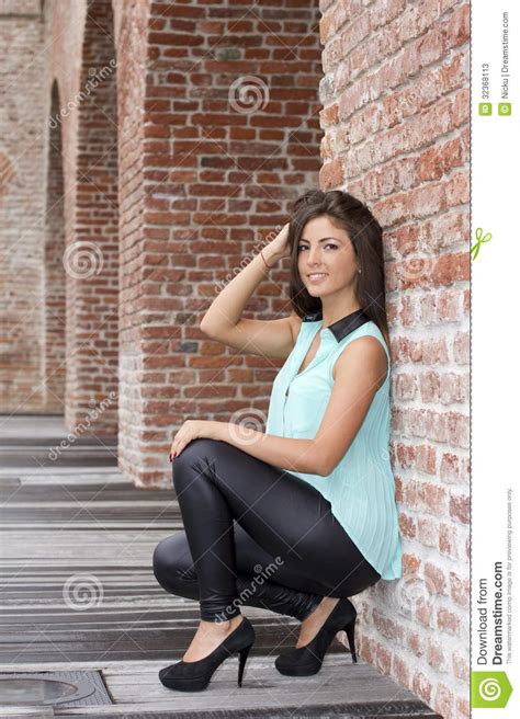 Brunette Leaning Against A Wall Stock Photos Image