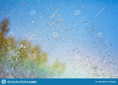 Rainbow In Splashes Of A Fountain As An Abstract Background Stock Image