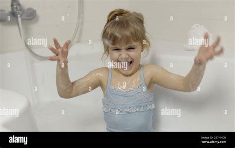 Attractive Four Years Old Girl Takes A Bath In Swimwear Hygiene For