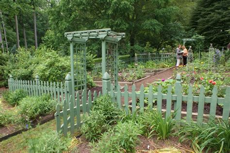 Vegetable Garden With A Green Picket Fence