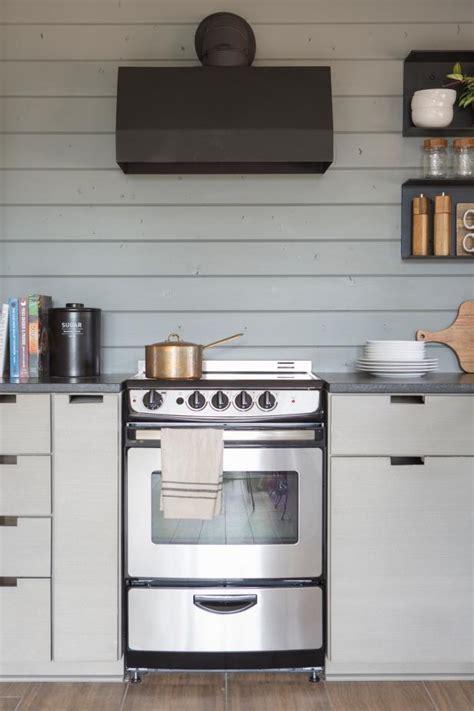 More dramatic shades of matt grey create instant impact, while the metallic shine of chrome and steel creates a clean, modern aesthetic. Contemporary Gray Kitchen with Stainless Steel Appliances ...