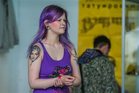 Portrait Of A Girl With Purple Hair And Tattoo On The Shoulder Fashion Of The Russian Teenagers
