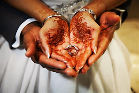 Henna Hand Decoration And Wedding Rings