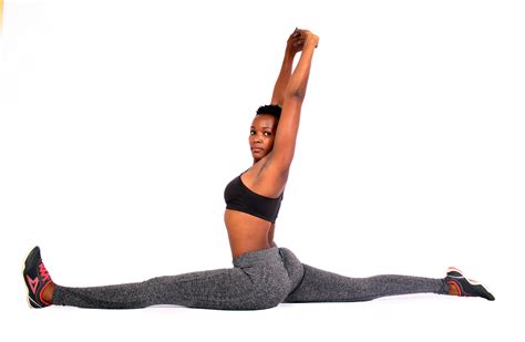 Flexible Woman Doing Yoga Split Exercise