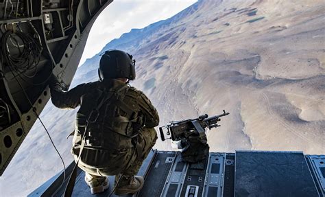 A Ch 47 Door Gunner Looks Out Across Afghanistan During Personnel