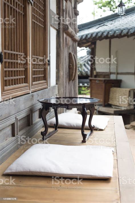 Wooden Korean Tea Table With Traditional Korean House In The Historic