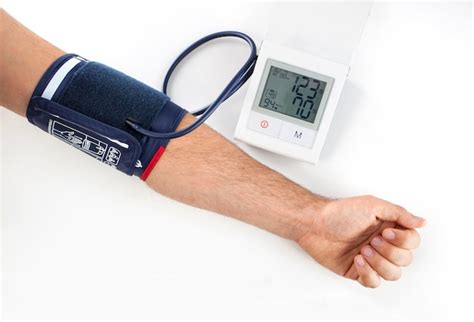 Doctor Checking Patient Arterial Blood Pressure Photo Free Download