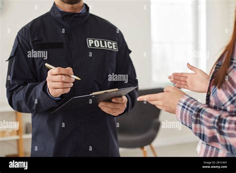 Policeman interrogating woman or witness regarding police investigation