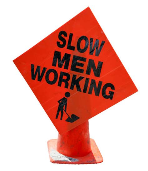 Slow Down Men At Work Sign Stock Photos Pictures And Royalty Free Images